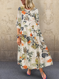 Elegantes Sommerkleid mit Blumendruck und Dreiviertelärmeln