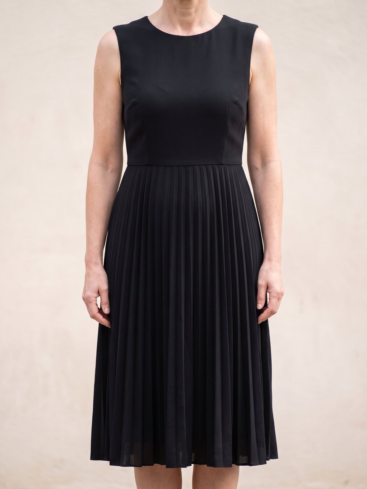 Women's Sleeveless Pleated Midi Dress in Black, front view