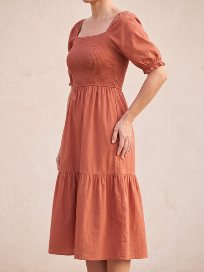 Women's Puff Sleeve Smocked Midi Dress in Terracotta, side view